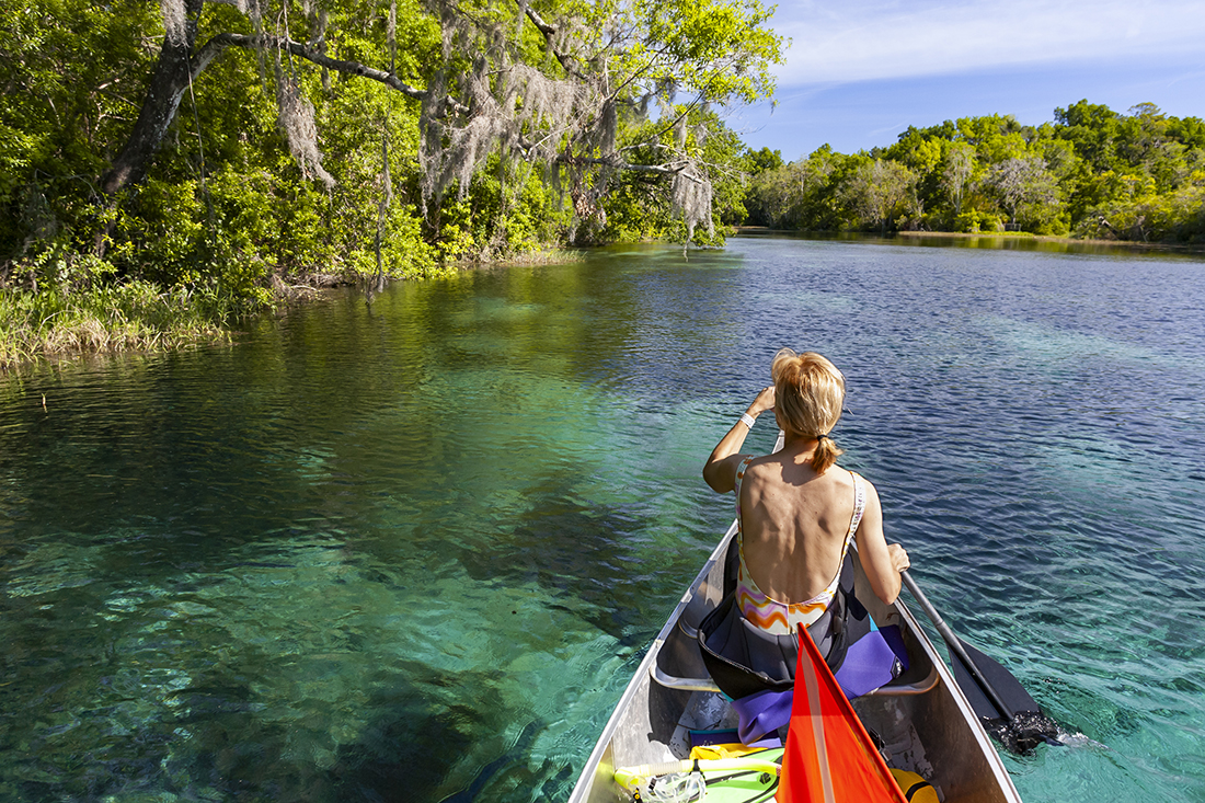 Heading upriver in canoe.