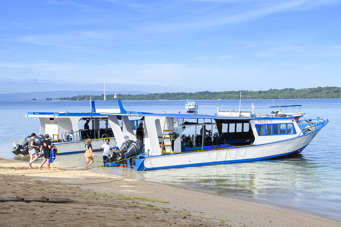 Siladen Dive Boats getting ready to depart from the beach.