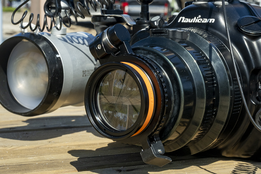 Nauticam MFO-1 (Mid-range Focus Optimizer) mounted to the front of a macro port via a Nauticam M67 Flip Diopter Holder.